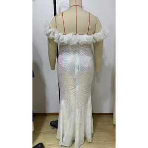 Detail of white sequin party dress with off-shoulder ruffles and fishtail hemline
