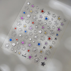 Detailed view of 3D metallic star nail stickers with hollow and solid gold designs