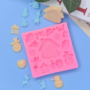 Pink Christmas silicone mold with snowman and gingerbread house for festive cake baking