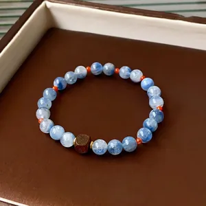 Blue kyanite and sandalwood square bead bracelet with elegant oriental style accents