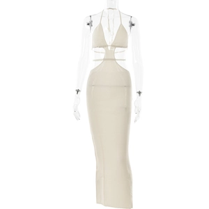 Detail of a beige knit halter dress showing side cut-outs and ribbed texture on the fabric