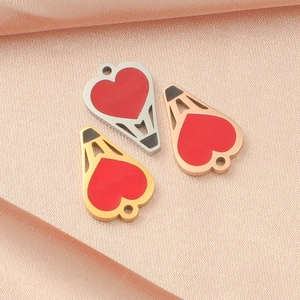 Detailed view of heart-shaped hot air balloon pendants in silver, gold and rose gold