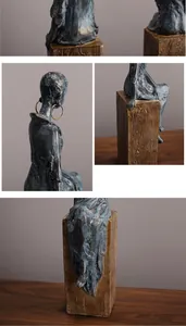 Vue détaillée de la sculpture africaine en bronze avec boucle d'oreille dorée chic