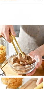 Macro detail of yellow silicone kitchen tong showing non-stick grip texture on mushrooms