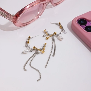 Two-tone 18K gold and silver earrings with pearl tassels and C-shape design