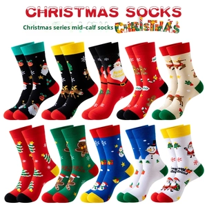 Flat lay of multiple colorful cotton Christmas socks featuring Santa and reindeer patterns