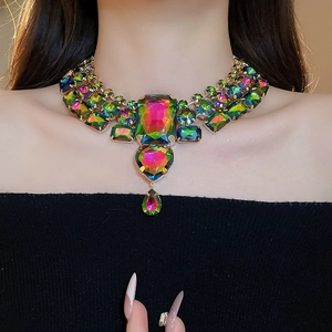 Macro detail of multicolored heart and teardrop crystal pendants on a luxury choker
