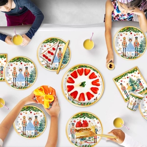 Macro detail of Christmas party paper plates and napkins with Nutcracker theme