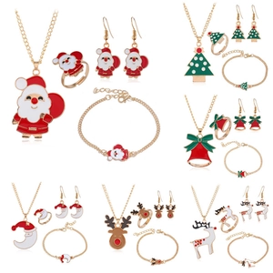 Macro display of Christmas jewelry sets featuring Santa, Reindeer, and Enamel charms