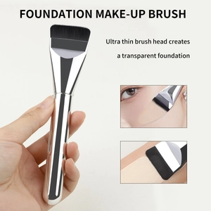 Macro view of ultra-thin flat foundation brush head for a seamless makeup finish