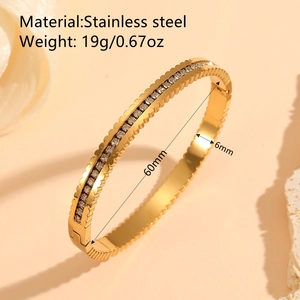 18k gold plated stainless steel bangle with white shell inlay and geometric diamond pattern