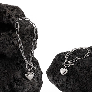 Silver heart pendant chain bracelet with industrial link design and toggle clasp closure