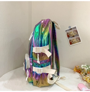 Detail of holographic laser backpack with adjustable side buckles and purple-green metallic finish