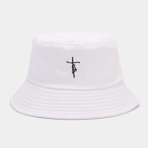 Detail of white cotton bucket hat featuring black faith cross embroidery and stitched brim