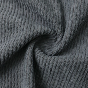 Detailed close-up showing the dark grey corduroy fabric texture and ribbed pattern on shirt