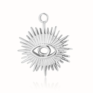 Macro view of evil eye stainless steel pendant with radial rays and polished finish
