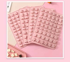 Pink silicone mold with cute animal and fruit shapes for DIY candy and chocolate