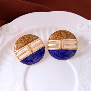 Vintage round enamel stud earrings with brown and blue marble texture in gold frame