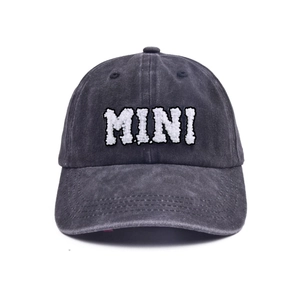 Detail shot of the 3D MINI alphabet embroidery on washed grey cotton baseball cap