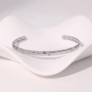 Polished silver stainless steel open bangle with three inset round cubic zirconia stones