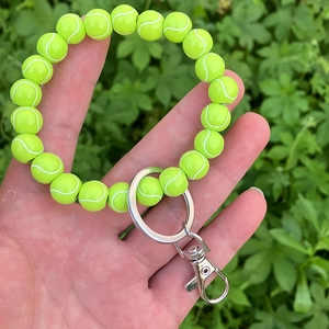 Tennis ball bead keychain wristlet with fluorescent green beads and silver metal clasp