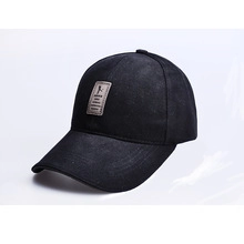 Close-up of black washed cotton baseball cap featuring a rectangular vintage logo patch