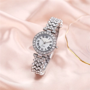 Luxury silver quartz watch for women with rhinestones on pink silk background