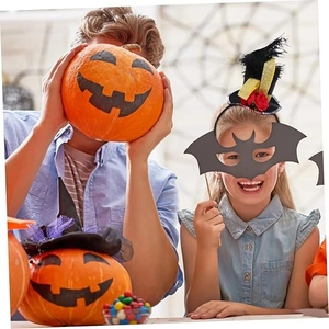 Close-up of Halloween party set featuring pumpkin masks, feather hat headband and felt bat prop