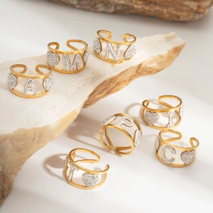 Adjustable gold stainless steel letter ring with hollow heart and sparkling zircon inlay