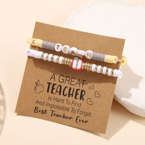 Detail of teacher appreciation clay bead bracelets with apple charm and message card