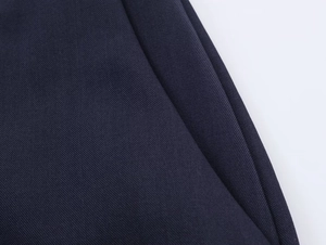 Macro shot of high-quality dark navy twill fabric texture for women's professional suits