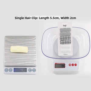 Detail showing precise weight and dimensions of embroidered floral fabric hair clips