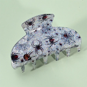 Pince à cheveux Halloween pailletée argentée avec motif de toile d'araignée noire