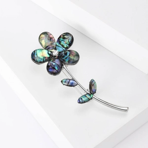 Elegant vintage flower brooch with abalone shell petals and a silver finish