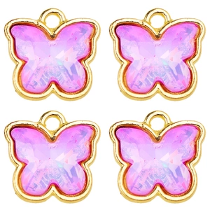 Detailed view of four pink crystal butterfly pendants with gold metal borders for DIY jewelry