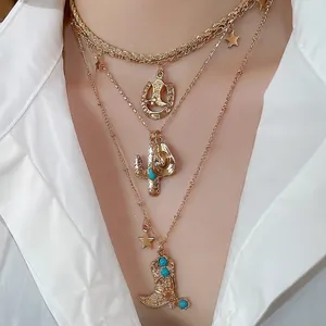 Western cowboy style layered necklace with turquoise boot and star charms on model