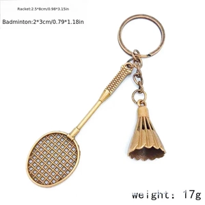 Detail view of mini bronze badminton racket keychain with specific size and weight labels