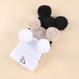 Three-pack of kids knit beanie hats with twin pom-poms and cute dinosaur embroidery