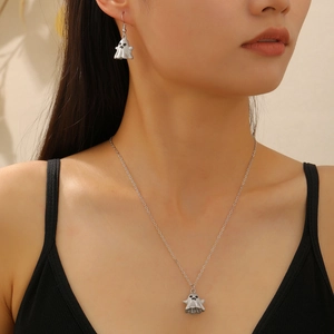Detail shot of cute ghost-shaped necklace and earrings set on a model for Halloween