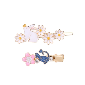 Detailed view of hair clips with cartoon rabbit, cat, and cherry blossom enamel finish
