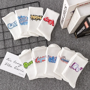 Athletic crew socks in white ribbed cotton with stylish graffiti typography design