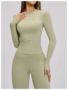 Detail of high-stretch sage green brushed yoga set with seamless stitching and matte texture