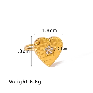 Detail of 18K gold-plated heart ring featuring a star-shaped pattern and rhinestones
