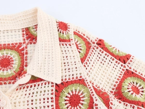Detailed close-up of handmade crochet shirt showing multi-color hollow knit and collar button