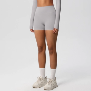 Detailed view of high-waisted fitness shorts with lifting effect and seamless texture