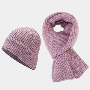 Macro detail of purple knit texture on winter beanie hat and scarf warm set