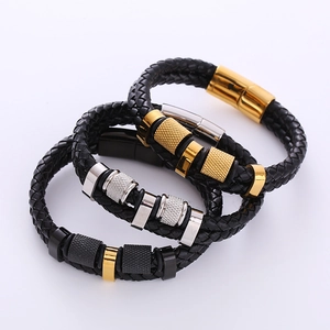 Close-up of woven leather bracelets with knurled stainless steel magnetic clasps