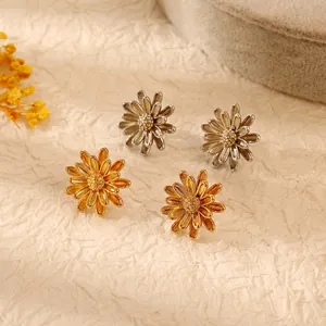 18k gold and silver chrysanthemum stud earrings in a minimalist floral daisy design