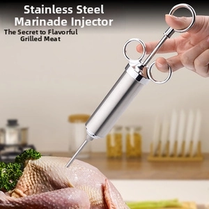 Macro view of stainless steel meat injector with needle for marinating turkey or poultry