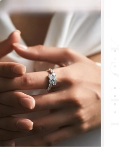 Close-up of S925 silver cluster ring with sparkling crystals worn on a female finger
